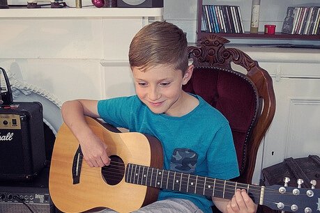 Guitar lesson with a child.
